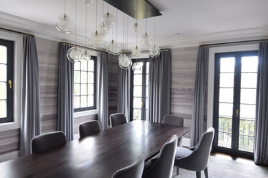 Inspiration for a mid-sized transitional dark wood floor and brown floor enclosed dining room remodel in New York with gray walls and no fireplace