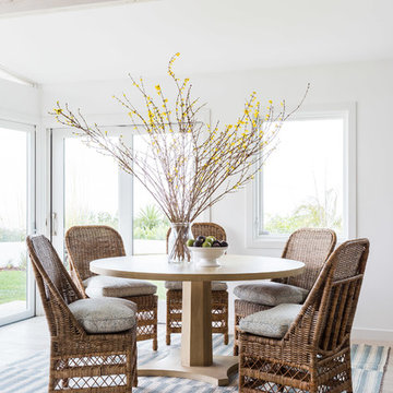 Warm Transitional Coastal Dining Room with Woven Chairs