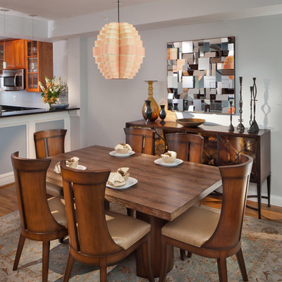 Trendy medium tone wood floor kitchen/dining room combo photo in Orange County with gray walls