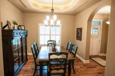 Mid-sized elegant light wood floor and multicolored floor kitchen/dining room combo photo in Other with beige walls