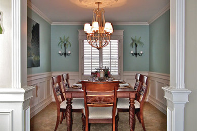 Mid-sized elegant carpeted enclosed dining room photo in Orange County with blue walls