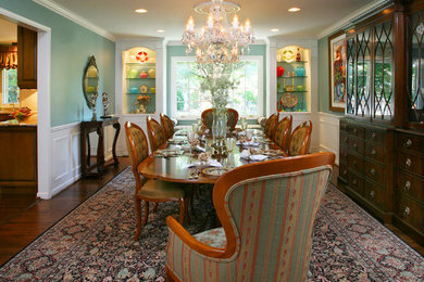 Inspiration for a timeless dark wood floor dining room remodel in Detroit with blue walls
