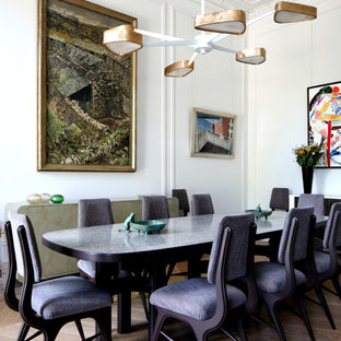 Medium sized traditional dining room in London with white walls, light hardwood flooring and beige floors.