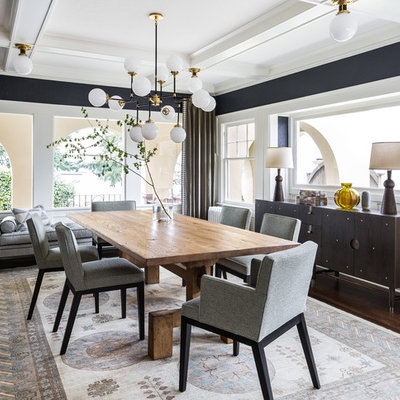 Inspiration for a transitional dark wood floor dining room remodel in Seattle with black walls