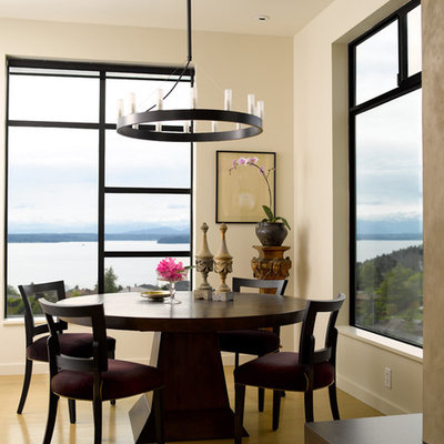 Dining room - contemporary medium tone wood floor dining room idea in Seattle with white walls