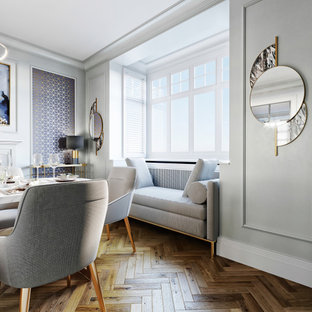 Idéer för en mellanstor modern matplats, med grå väggar, laminatgolv, en standard öppen spis och brunt golv