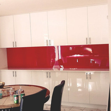 White Acrylic cabinets on Red Acrylic Backsplash