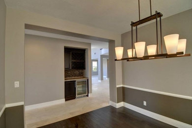 Kitchen/dining room combo - large porcelain tile and brown floor kitchen/dining room combo idea in Other