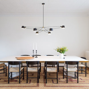 Inspiration for a victorian medium tone wood floor enclosed dining room remodel in New York with white walls
