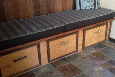 Example of a small mountain style slate floor dining room design in Sacramento with beige walls