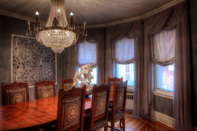 Mid-sized ornate light wood floor enclosed dining room photo in New York with beige walls and no fireplace