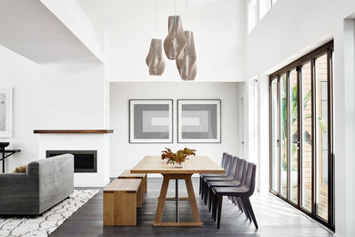 Example of a trendy dark wood floor and brown floor dining room design in San Francisco with white walls