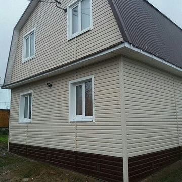Двухэтажный дом с мансардной крышей