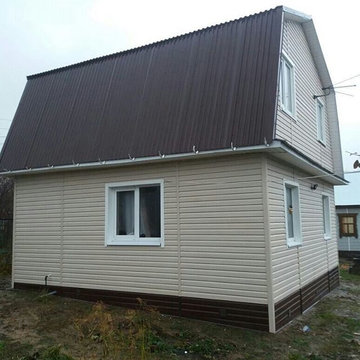 Двухэтажный дом с мансардной крышей