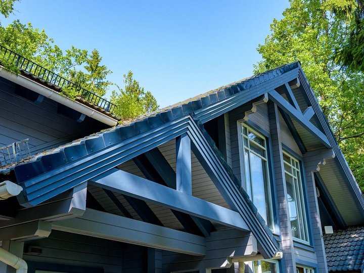 Mid-sized transitional blue two-story wood exterior home photo with a tile roof