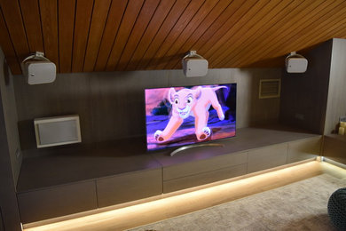 Inspiration for a small scandinavian enclosed home cinema in Moscow with a built-in media unit.