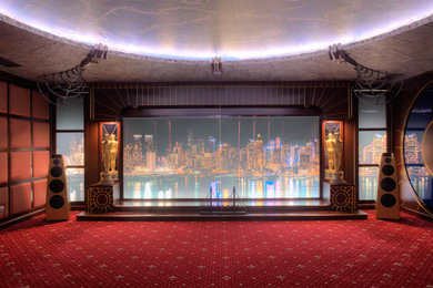 Imagen de cine en casa cerrado ecléctico con paredes rojas, moqueta, pantalla de proyección y suelo rojo