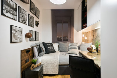 Design ideas for a small midcentury teen’s room for boys in Barcelona with white walls and medium hardwood flooring.
