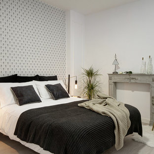 Modelo de dormitorio escandinavo con paredes blancas y suelo gris