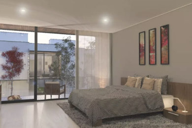 Diseño de dormitorio tipo loft moderno con paredes beige, suelo de madera clara, estufa de leña, marco de chimenea de madera y suelo blanco