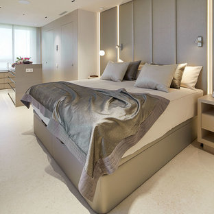 Modelo de dormitorio principal, actual, con paredes grises y suelo beige