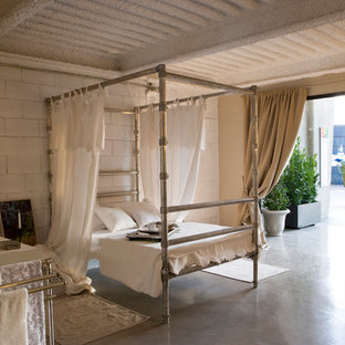Design ideas for a large eclectic master bedroom in Barcelona with white walls and a standard fireplace.