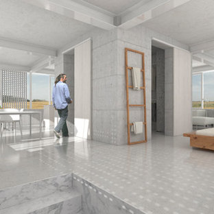 Foto de dormitorio tipo loft, actual, grande, con paredes blancas, suelo de cemento, estufa de leña y suelo gris