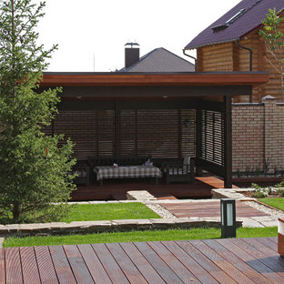 Esempio di un patio o portico scandinavo in cortile con un gazebo o capanno