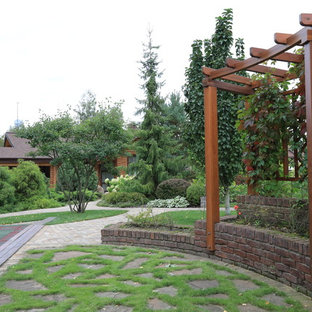 Foto di un patio o portico country con una pergola