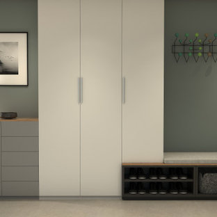 Bild på en liten minimalistisk foajé, med klinkergolv i keramik och en enkeldörr