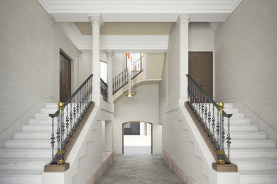 Diseño de vestíbulo clásico grande con paredes beige, suelo de granito, puerta de madera oscura y puerta simple