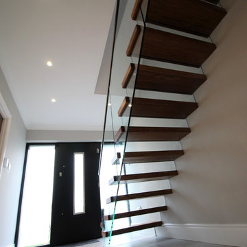 Cantilevered Stairs with Glass Balustrade and risers