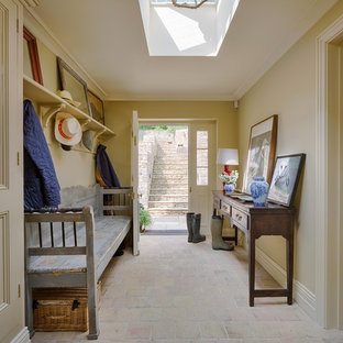 Design ideas for a country hallway in Gloucestershire with beige walls, terracotta flooring, a single front door, a white front door and beige floors.