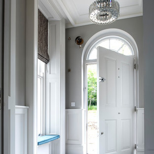 Inspiration for a large classic foyer in London with grey walls, a single front door, a white front door and multi-coloured floors.
