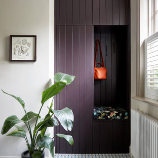 Design ideas for a medium sized classic entrance in London with beige walls, ceramic flooring and blue floors.
