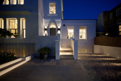 Large contemporary entrance in London with a single front door and a grey front door.