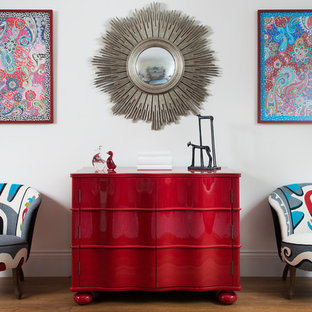 Traditional entrance in London with white walls and medium hardwood flooring.