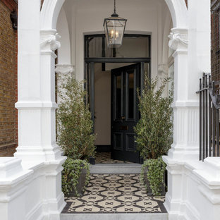 Inspiration for a classic front door in London with a single front door and a black front door.
