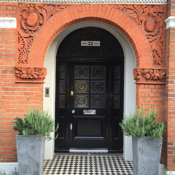 Timber Front Door painted black with leaded windows