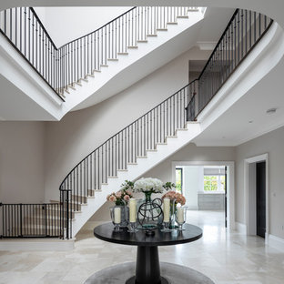 Photo of a classic foyer in Other with beige walls and beige floors.