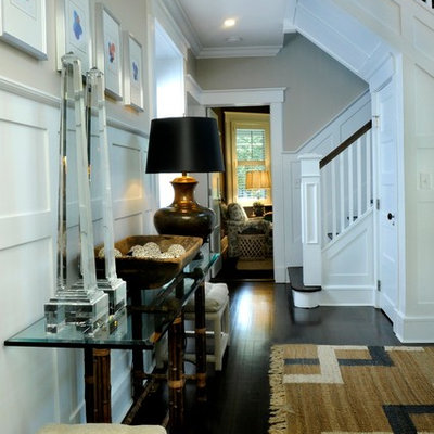 Example of a farmhouse dark wood floor foyer design in New York