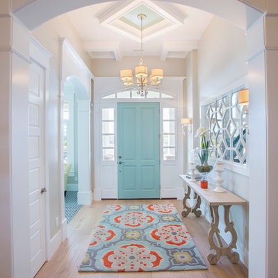 Entryway - mid-sized transitional medium tone wood floor and beige floor entryway idea in Salt Lake City with beige walls and a blue front door