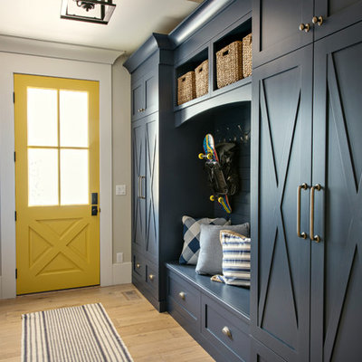 Transitional light wood floor and beige floor mudroom photo in Denver with beige walls and a yellow front door