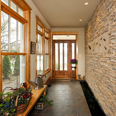 Entryway - small traditional ceramic tile entryway idea in DC Metro with a glass front door and white walls