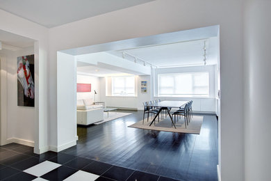 Example of a large trendy foyer design in New York with white walls