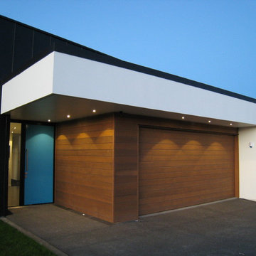 A level, covered and well-lit entry into the home and garage