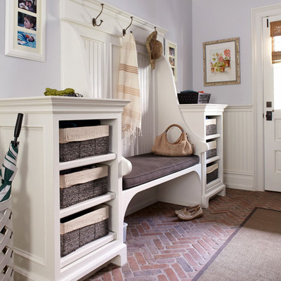 Mudroom - traditional brick floor mudroom idea in New York