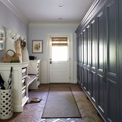 Inspiration for a timeless brick floor mudroom remodel in New York