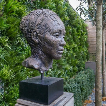 Amazing Sculpture gets Highlighted with Artificial Foliage