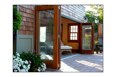 Large beach style entryway photo in Toronto with a dark wood front door